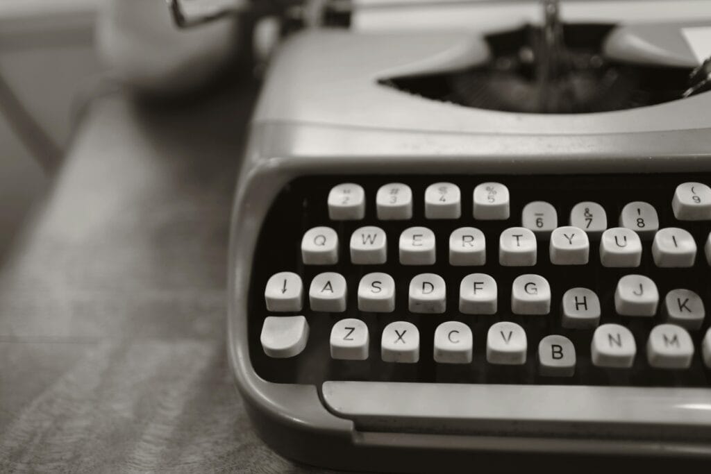 old fashioned vintage typewriter writer writing black and white